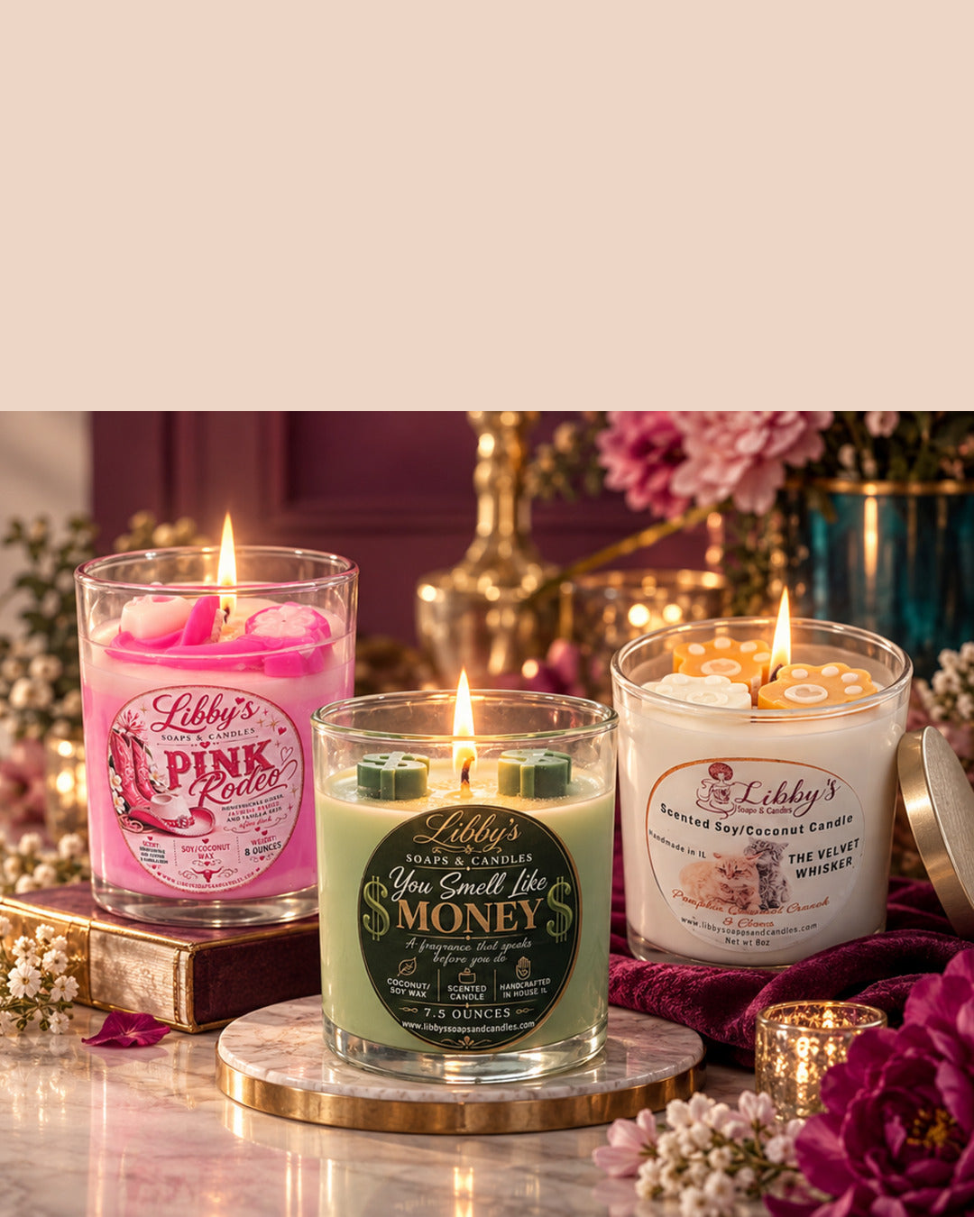 Three handcrafted Libby’s candles with glowing flames